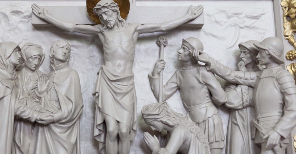 Marble depiction of Christ at the Cross with Mary and others