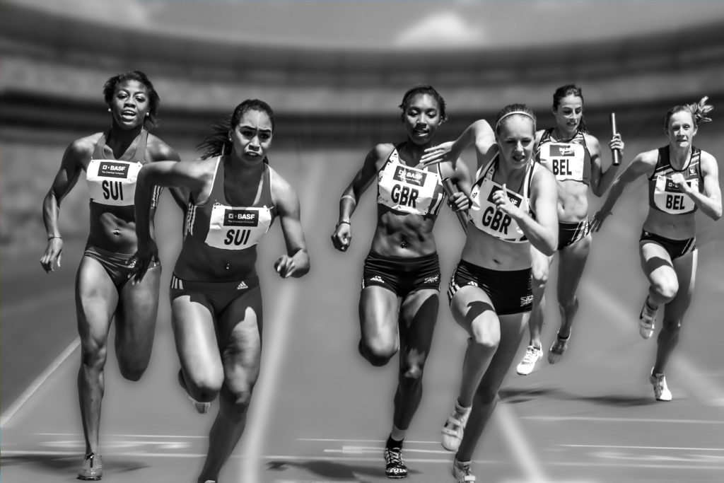 Women running track in a race
